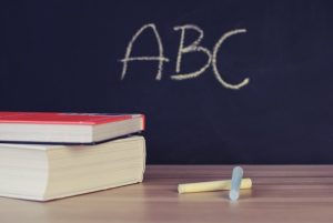 2-books-chalk-and-blackboard-in-classroom